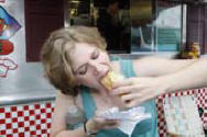 Munchmobile's Fiona Bride of Gillette dives into a hot dog with sauerkraut at Curbside Cafe Famous Hot Dogs in Parsippany, Stating "This Sauerkraut Is The BEST" - (Photo by Tim Farrell/The Star-Ledger) 